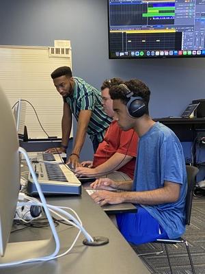 Students learn music production at West Side